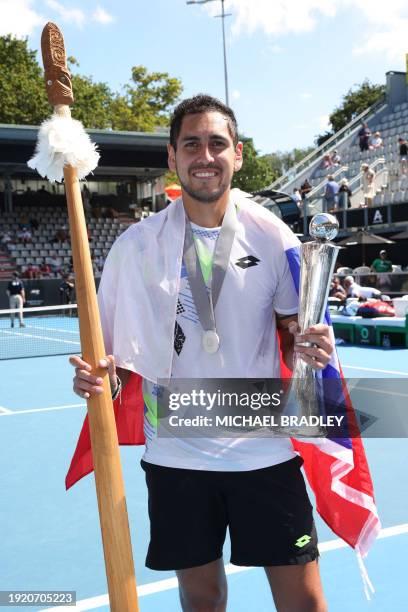 Chile's Alejandro Tabilo celebrates with the trophy after winning his men's singles final match against Japan's Taro Daniel at the Auckland Classic...