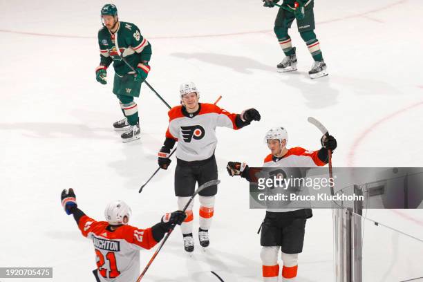 Scott Laughton, Owen Tippett and Joel Farabee of the Philadelphia Flyers celebrate a goal by Farabee Minnesota Wild during the overtime period of the...