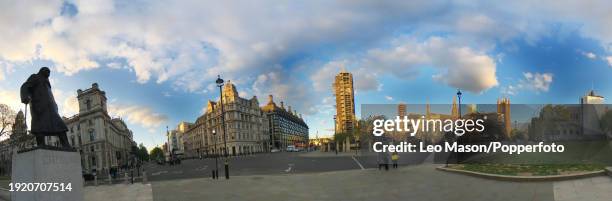 The statue of Winston Churchill looks over an almost deserted view of Parliament Square in London, from a series of panoramic digitally composed...