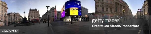 Twilight in London as the sun sets over Piccadilly Circus, from a series of panoramic digitally composed images to illustrate the empty streets in...