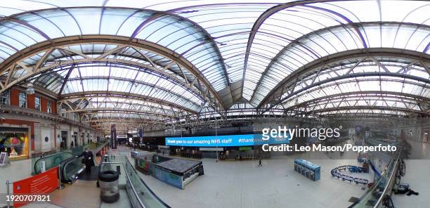 The almost deserted interior of Waterloo Station in London from a series of panoramic digitally composed images to illustrate this major City during...