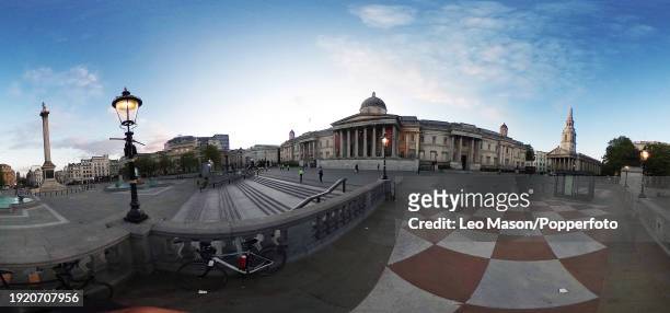 An almost deserted view of Trafalgar Square in London, from a series of panoramic digitally composed images to illustrate the empty streets in this...