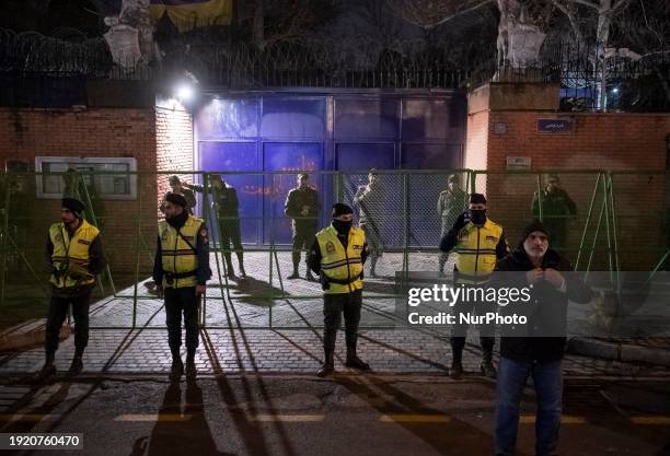 Iranian diplomatic police forces are standing guard in front of the British embassy amidst a gathering of anti-U.S. And anti-British protesters in...