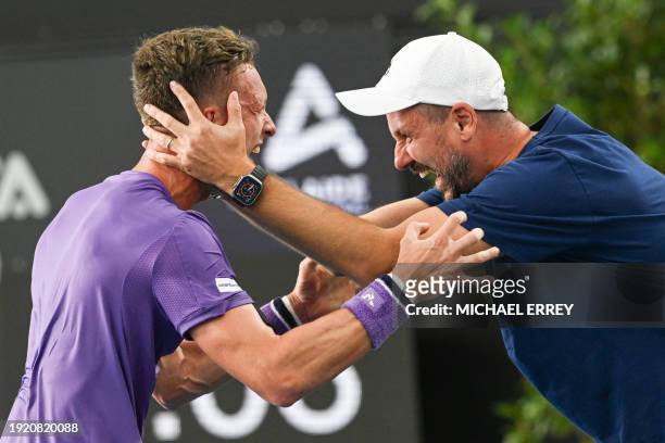Czech Republic's Jiri Lehecka celebrates with his coach Michal Navratil after his victory against Britain's Jack Draper during the men's singles...