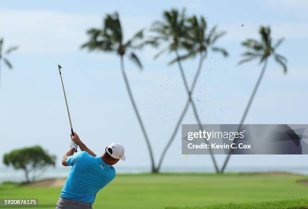 Gary Woodland of the United States plays a shot on the 16th hole during a practice round prior to the Sony Open in Hawaii at Waialae Country Club on...