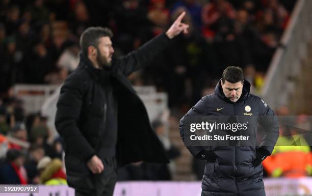 Tottenham head coach Mauricio Pochettino looks on as Middlesbrough head coach Michael Carrick makes a point on the touchline during the Carabao Cup...