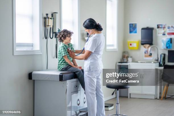 medical check-up - boy exam stock pictures, royalty-free photos & images