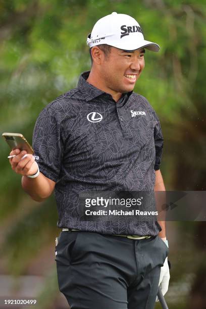 Hideki Matsuyama of Japan laughs during a practice round prior to the Sony Open in Hawaii at Waialae Country Club on January 09, 2024 in Honolulu,...