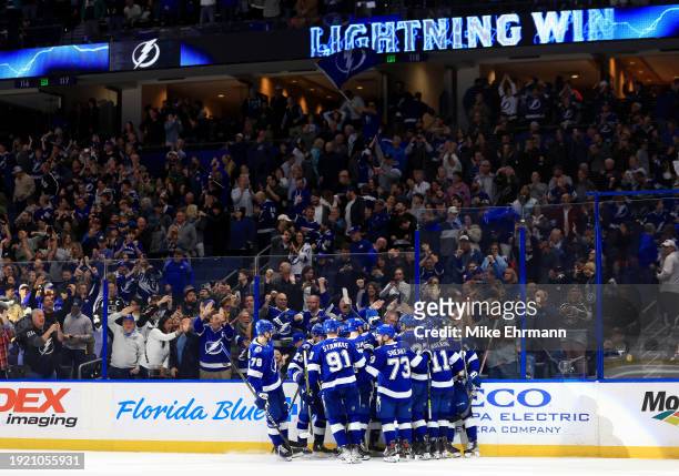 Nick Perbix of the Tampa Bay Lightning celebrates a game winning goal in overtime during a game against the Los Angeles Kings at Amalie Arena on...