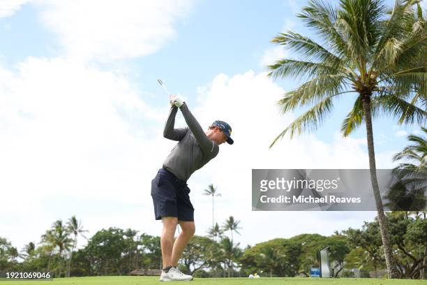 Max Greyserman of the United States plays a shot on the third hole during a practice round prior to the Sony Open in Hawaii at Waialae Country Club...