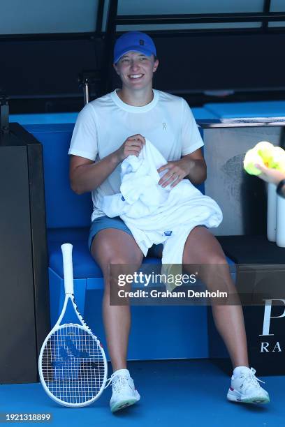 Iga Swiatek of Poland smiles during a training session ahead of the 2024 Australian Open at Melbourne Park on January 10, 2024 in Melbourne,...
