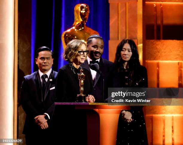 Michelle Satter accepts the Jean Hersholt Humanitarian Award from Ryan Coogler and Chloé Zhao onstage during the Academy Of Motion Picture Arts &...