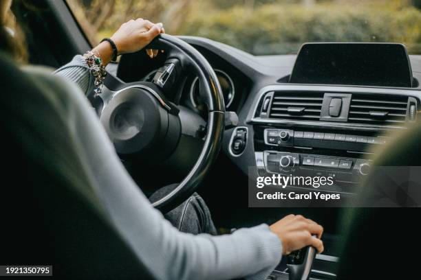 young woman driving.travel concept - cuadro de instrumentos fotografías e imágenes de stock