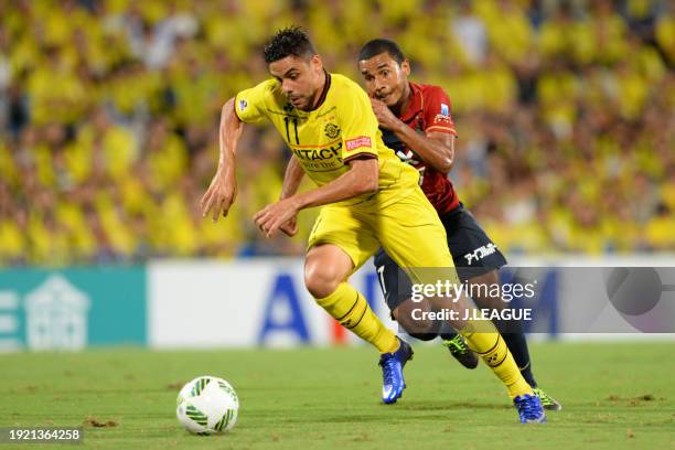 Diego Oliveira of Kashiwa Reysol controls the ball against Wellington Daniel Bueno of Kashima Antlers during the J.League J1 second stage match...