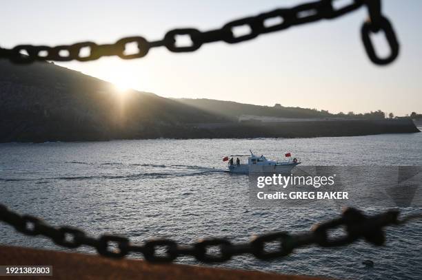 Tour boat returns to harbour after sailing in the Taiwan Strait, on Pingtan Island, in China's southeast Fujian province, the closest point in China...