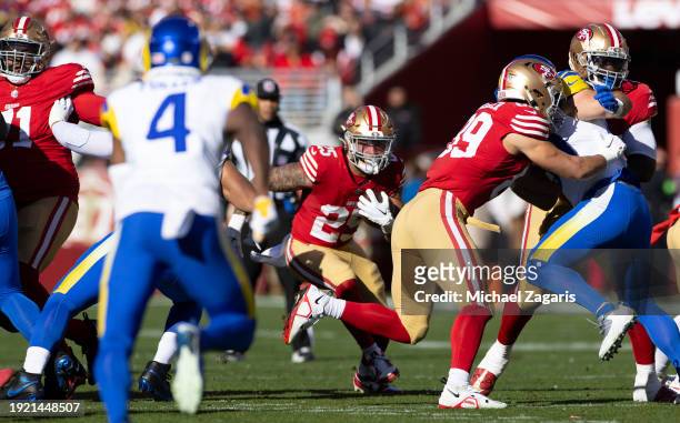 Elijah Mitchell of the San Francisco 49ers rushes during the game against the Los Angeles Rams at Levi's Stadium on January 7, 2024 in Santa Clara,...