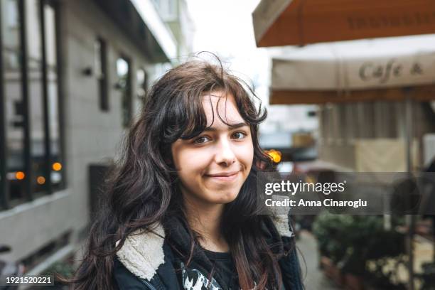 turkish girl tourist walks along the narrow streets of an old town in europe - girl rising stock-fotos und bilder