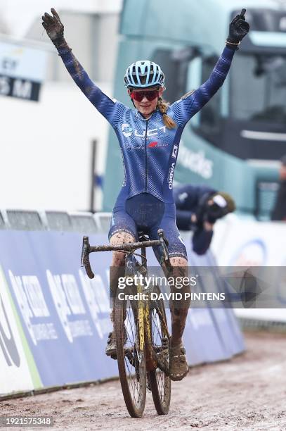 Belgian Ilken Seynave celebrates as she crosses the finish line to win the junior women race at the Belgian Championships cyclocross cycling in...