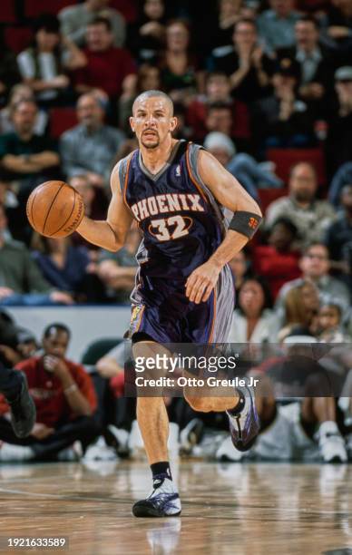 Jason Kidd, Point Guard and Shooting Guard for the Phoenix Suns in motion dribbling the basketball down court during the NBA Pacific Division...
