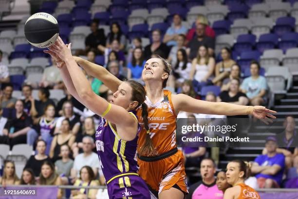 Sara Blicavs of the Boomers and Courtney Woods of the Fire contest the ball during the WNBL match between Melbourne Boomers and Townsville Fire at...