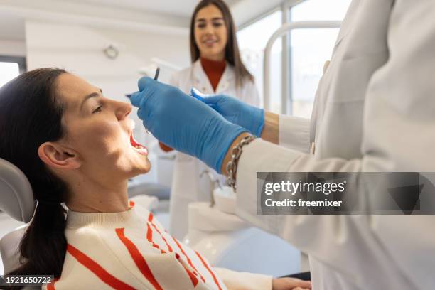 female patient at dental office - dental drill stock pictures, royalty-free photos & images