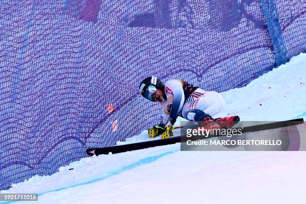 Norway's Aleksander Aamodt Kilde reatcs after crashing during the Downhill of the FIS Alpine Skiing Men's World Cup event in Wengen on January 13,...