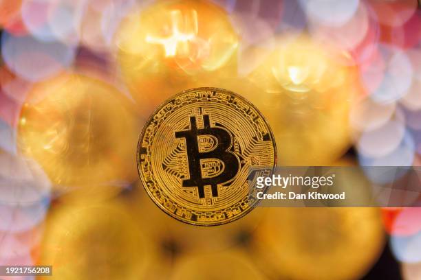 In this photo illustration, a visual representation of the digital Cryptocurrency, Bitcoin is seen on January 09, 2024 in London, England. Bitcoin...