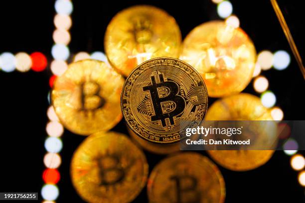 In this photo illustration, a visual representation of the digital Cryptocurrency, Bitcoin is seen on January 09, 2024 in London, England. Bitcoin...