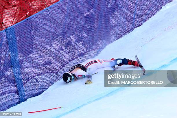 Norway's Aleksander Aamodt Kilde lies on the snow after crashing during the Downhill of the FIS Alpine Skiing Men's World Cup event in Wengen on...