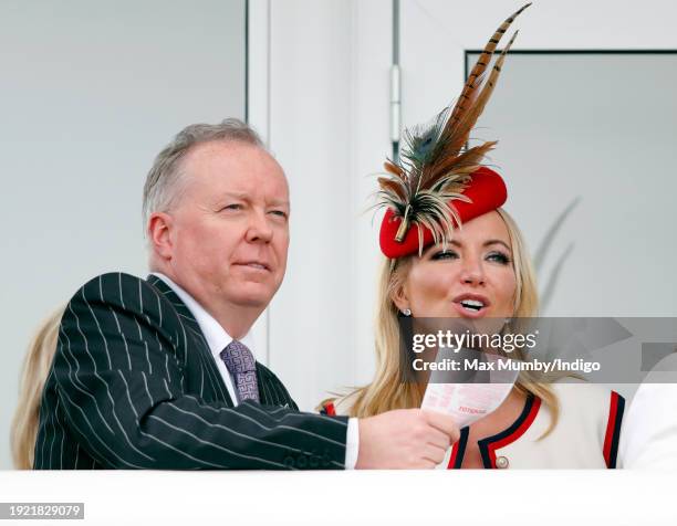 Doug Barrowman and Baroness Michelle Mone watch the racing as they attend day 4 'Gold Cup Day' of the Cheltenham Festival at Cheltenham Racecourse on...