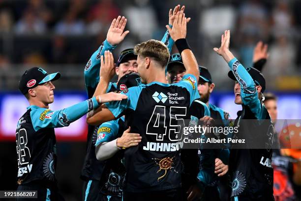 Spencer Johnson of the Heat celebrates dismissing Sam Whiteman of the Scorchers during the BBL match between the Brisbane Heat and the Perth...