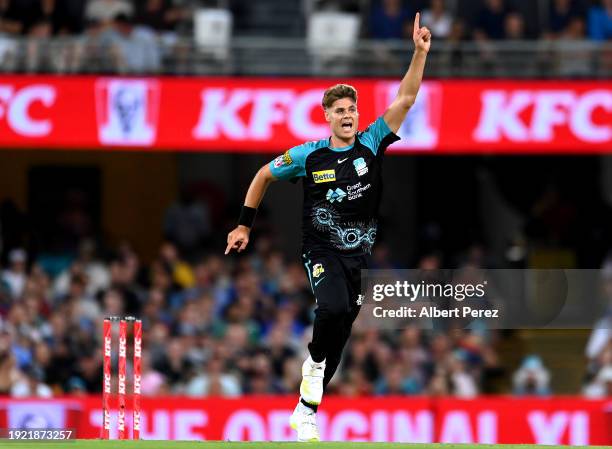 Spencer Johnson of the Heat celebrates dismissing Sam Whiteman of the Scorchers during the BBL match between the Brisbane Heat and the Perth...