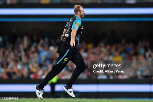 Paul Walter of the Heat celebrates dismissing Aaron Hardie of the Scorchers during the BBL match between the Brisbane Heat and the Perth Scorchers at...