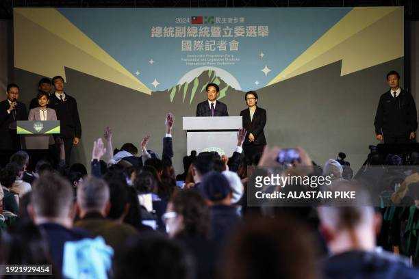 Taiwan's President-elect Lai Ching-te and his running mate Hsiao Bi-khim attend a press conference outside the headquarters of the Democratic...