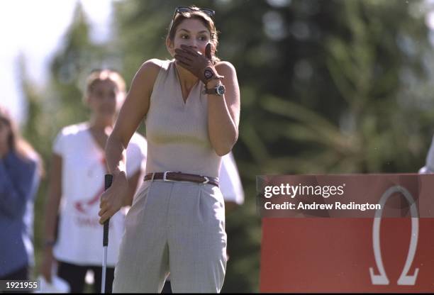 Supermodel Cindy Crawford of the USA hides her face during the Canon European Masters at the Crans Sur Sierre Golf Club in Switzerland. \ Mandatory...
