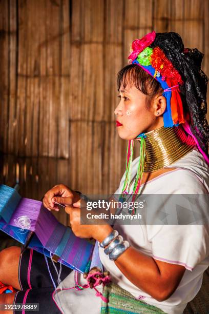 young woman from long neck karen tribe weaving on a traditional loom - karen stock pictures, royalty-free photos & images