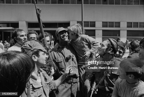 Lisboans and soldiers gather in the streets to welcome back the exiled socialist leader Mario Soares, three days after the April 25 coup d'etat which...