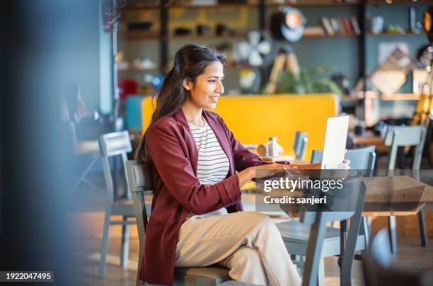 businesswoman on a lunch break - indian restaurant stock pictures, royalty-free photos & images