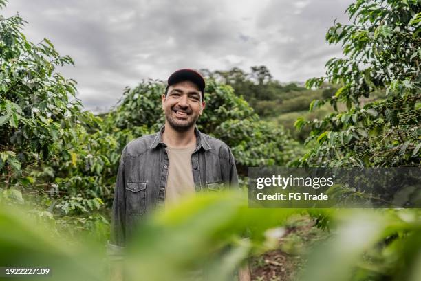 portrait of a farmer in a coffee plantation - coffee manufacturing stock pictures, royalty-free photos & images