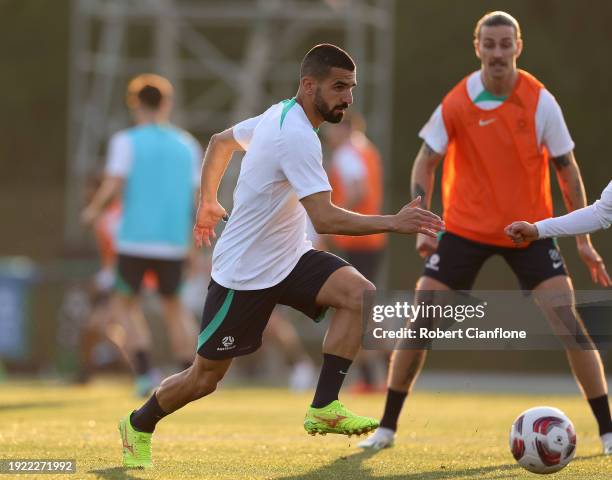 Aziz Behich of Australia runs with the ball during an Australia Socceroos training session ahead of the the AFC Asian Cup at Qatar University Field...