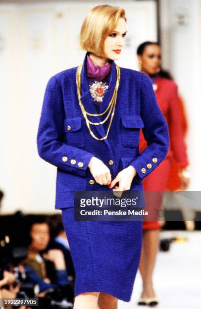 Model Dianne DeWitt walks in the Chanel Fall 1983 Ready to Wear Runway Show on March 21 in Paris, France.