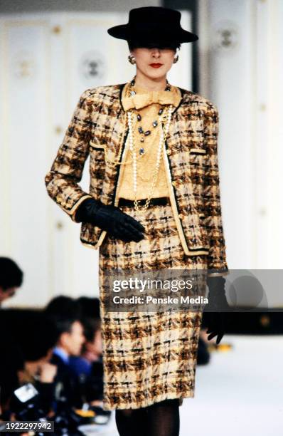 Model walks in the Chanel Fall 1983 Ready to Wear Runway Show on March 21 in Paris, France.