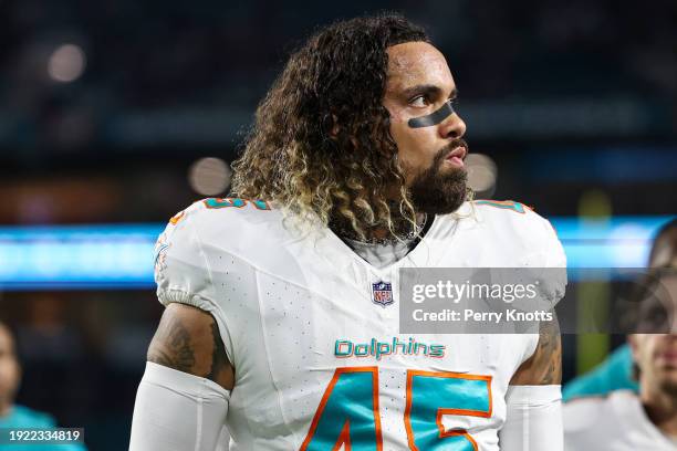 Duke Riley of the Miami Dolphins walks off of the field after warmups prior to an NFL football game against the Buffalo Bills at Hard Rock Stadium on...