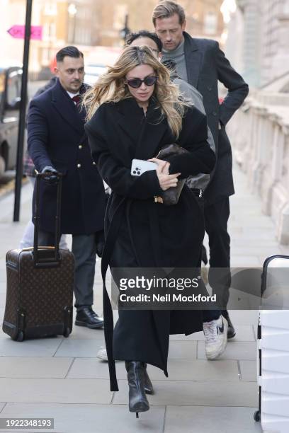 Peter Crouch and Abbey Clancy seen arriving at a hotel on Abbey's 38th Birthday on January 10, 2024 in London, England.