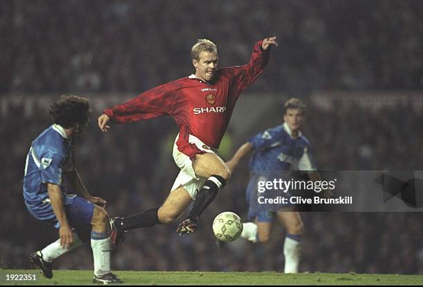 Henning Berg of Mancheser United takes on Gianfranco Zola of Chelsea watched by Mark Hughes also of Chelsea during an FA Carling Premiership match at...