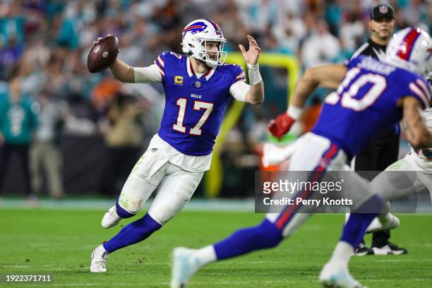Josh Allen of the Buffalo Bills scrambles out of the pocket during an NFL football game against the Miami Dolphins at Hard Rock Stadium on January 7,...