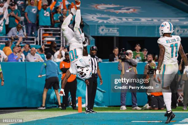 Tyreek Hill of the Miami Dolphins celebrates during an NFL football game against the Buffalo Bills at Hard Rock Stadium on January 7, 2024 in Miami...