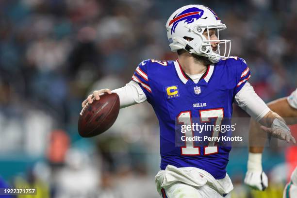 Josh Allen of the Buffalo Bills drops back to pass during an NFL football game against the Miami Dolphins at Hard Rock Stadium on January 7, 2024 in...
