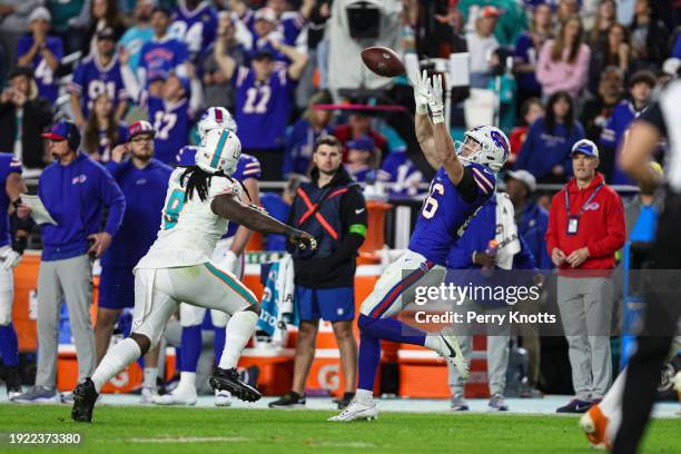 Dalton Kincaid of the Buffalo Bills makes a catch during an NFL football game against the Miami Dolphins at Hard Rock Stadium on January 7, 2024 in...