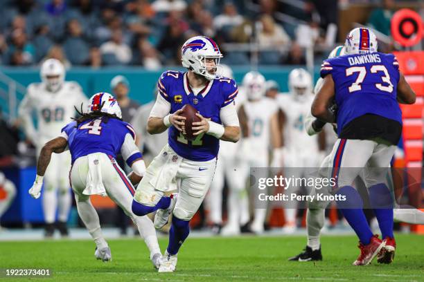 Josh Allen of the Buffalo Bills scrambles out of the pocket during an NFL football game against the Miami Dolphins at Hard Rock Stadium on January 7,...